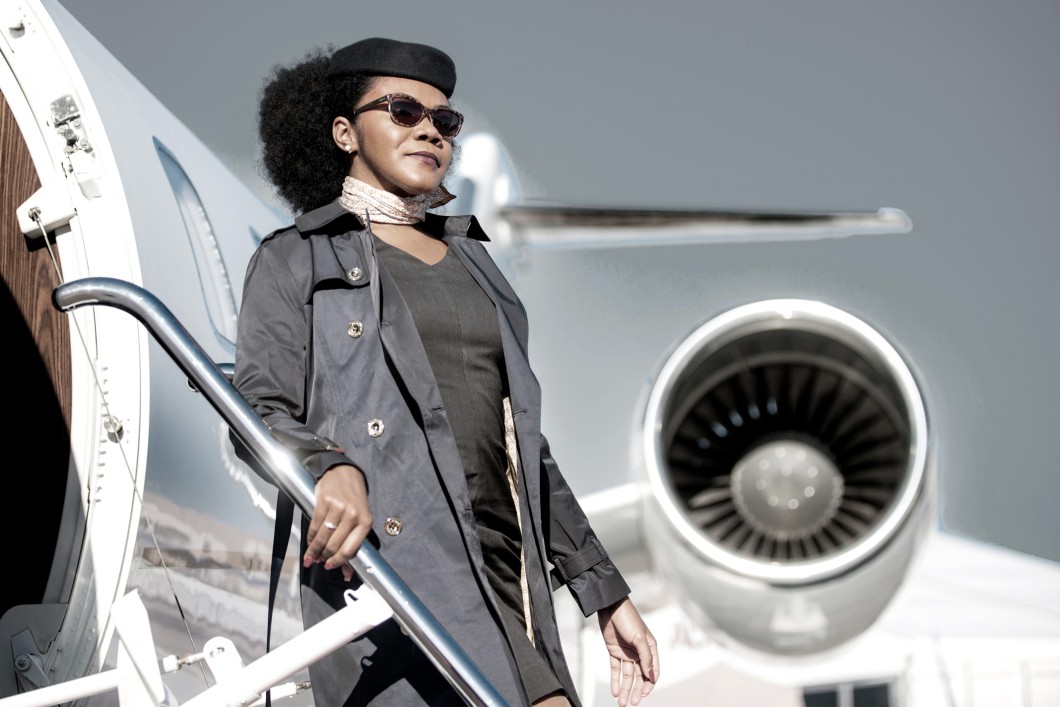 Flight attendant descending down an aircraft's boarding stairs