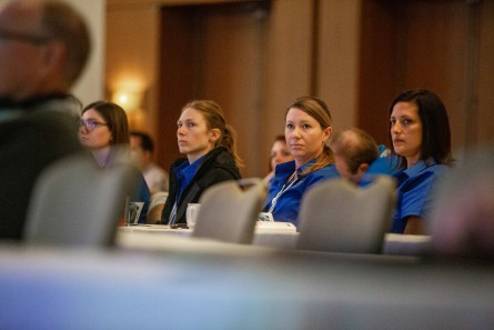 Attendees sitting in an audience