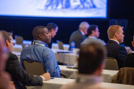 Attendees sitting in an audience